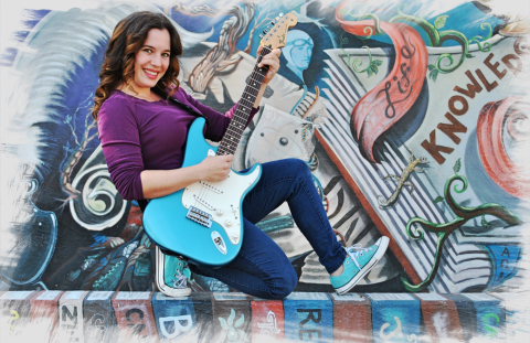 Woman playing an electric guitar