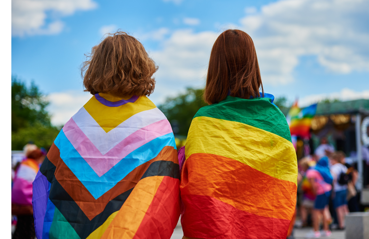 two people with pride flags