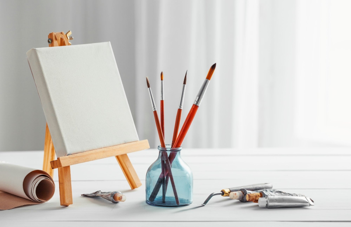 Canvas and paintbrushes on a table