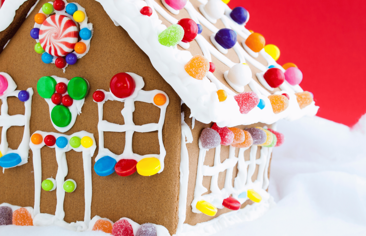 Photo of a gingerbread house with gumdrop and starlight mint decorations