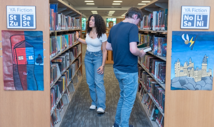 teens browsing the young adult fiction stacks